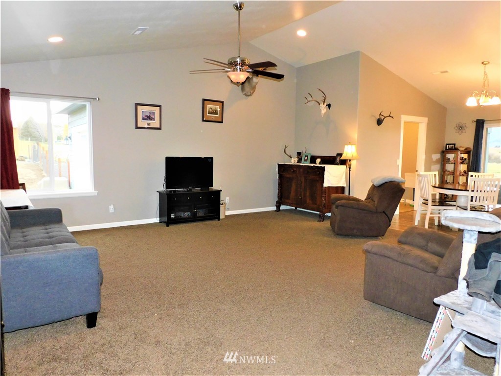 231 Sharp Road Tieton, WA 98947 - Photo 4 of 27 a living room with furniture and a flat screen tv