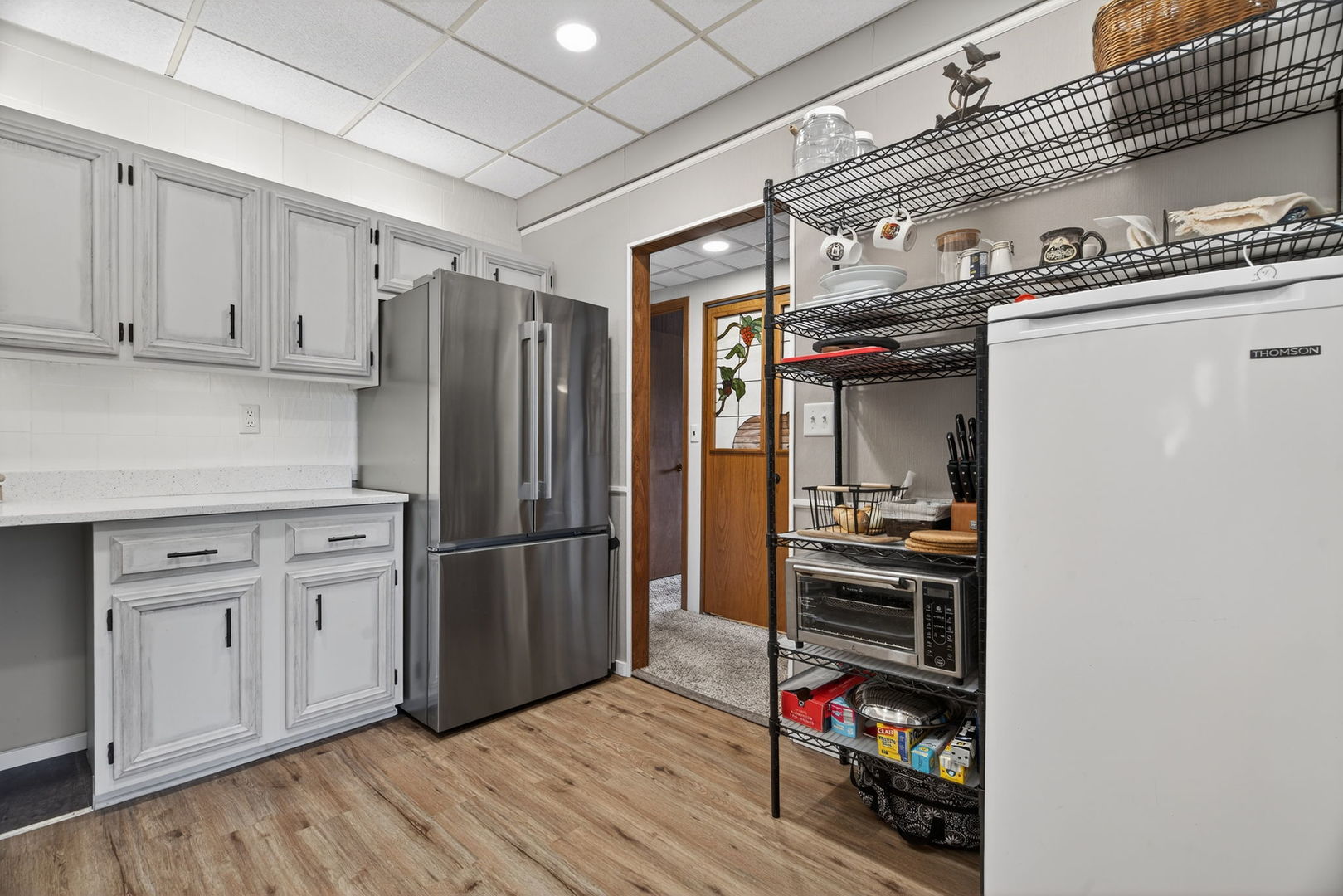 1504 Woodbridge Road, Unit 1A Joliet, IL 60436 - Photo 13 of 34 a kitchen with stainless steel appliances granite countertop a refrigerator and a stove