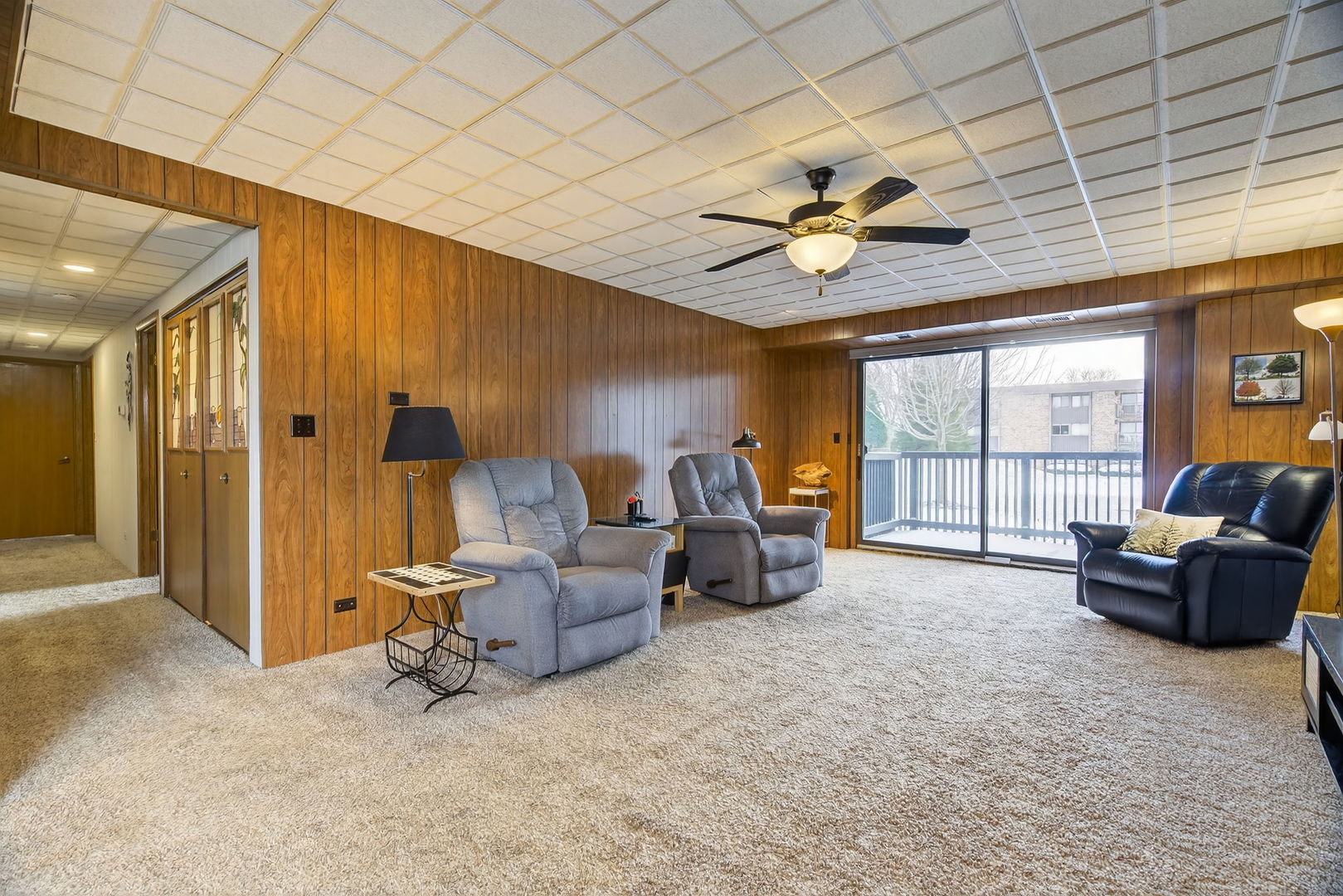 1504 Woodbridge Road, Unit 1A Joliet, IL 60436 - Photo 2 of 32 a living room with furniture and a chandelier