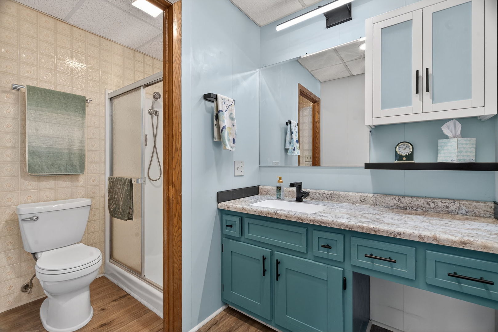 1504 Woodbridge Road, Unit 1A Joliet, IL 60436 - Photo 21 of 34 a bathroom with a toilet sink and mirror