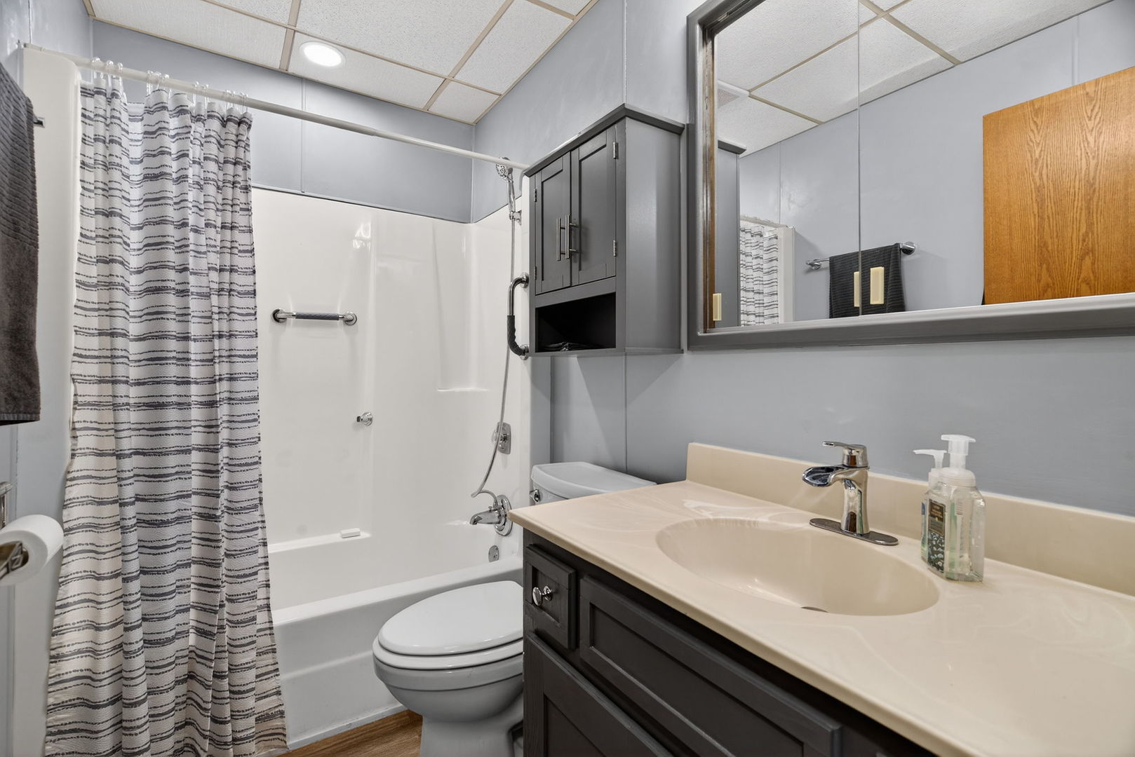 1504 Woodbridge Road, Unit 1A Joliet, IL 60436 - Photo 22 of 32 a bathroom with a granite countertop sink toilet and shower