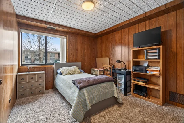 a bedroom with a bed and furniture