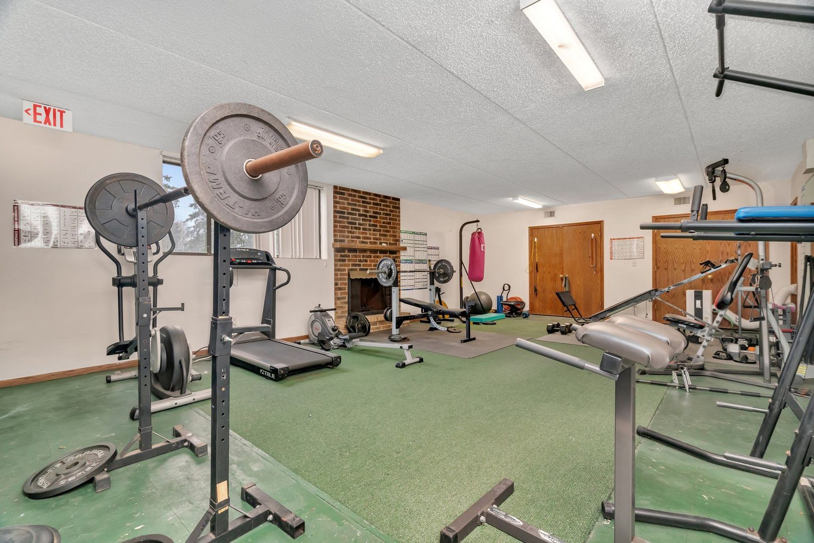 1504 Woodbridge Road, Unit 1A Joliet, IL 60436 - Photo 31 of 32 a view of a room with gym equipment