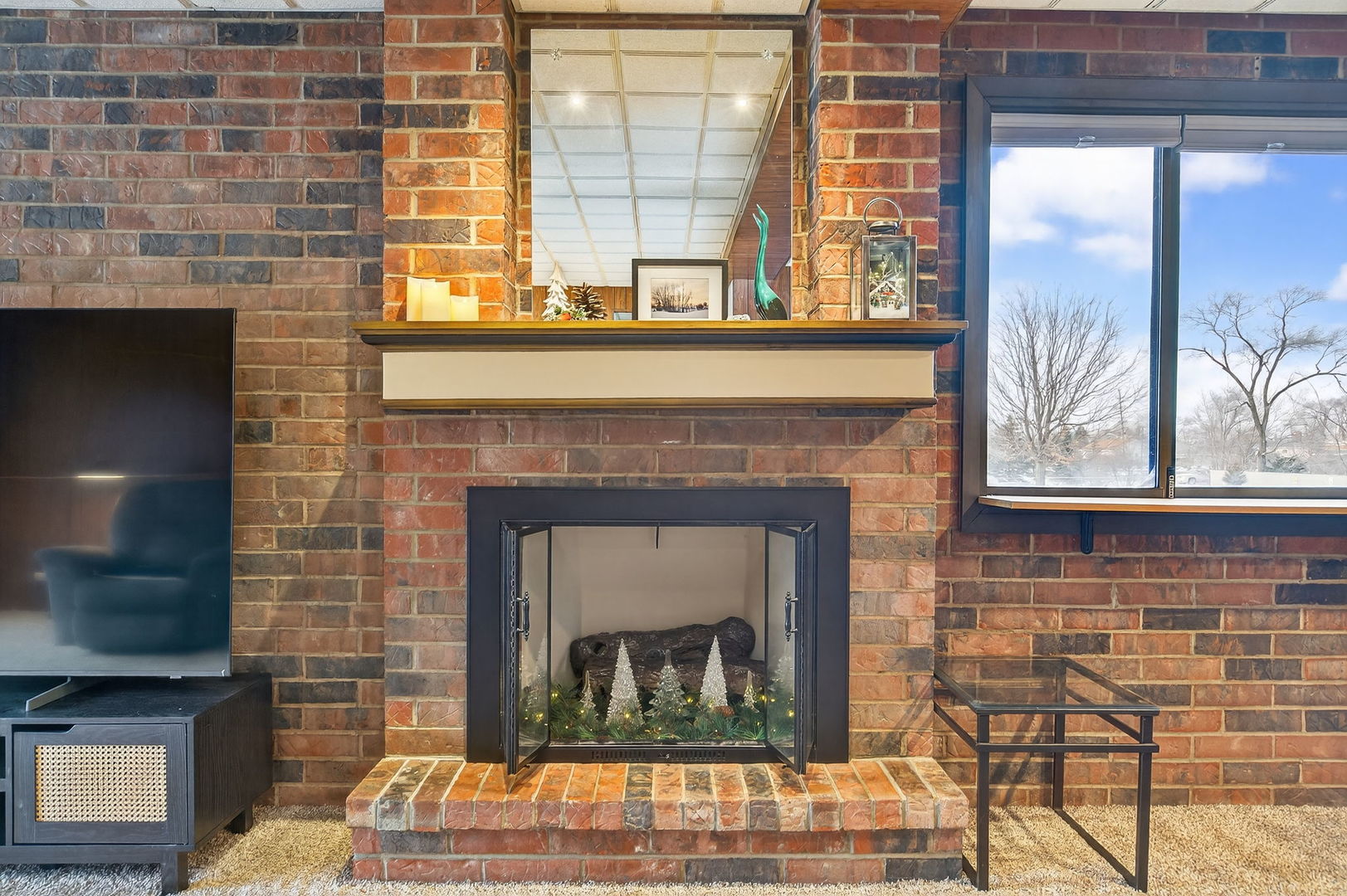 1504 Woodbridge Road, Unit 1A Joliet, IL 60436 - Photo 7 of 32 a living room with a fireplace and windows
