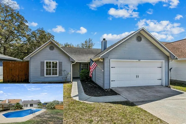 a view of a house with backyard