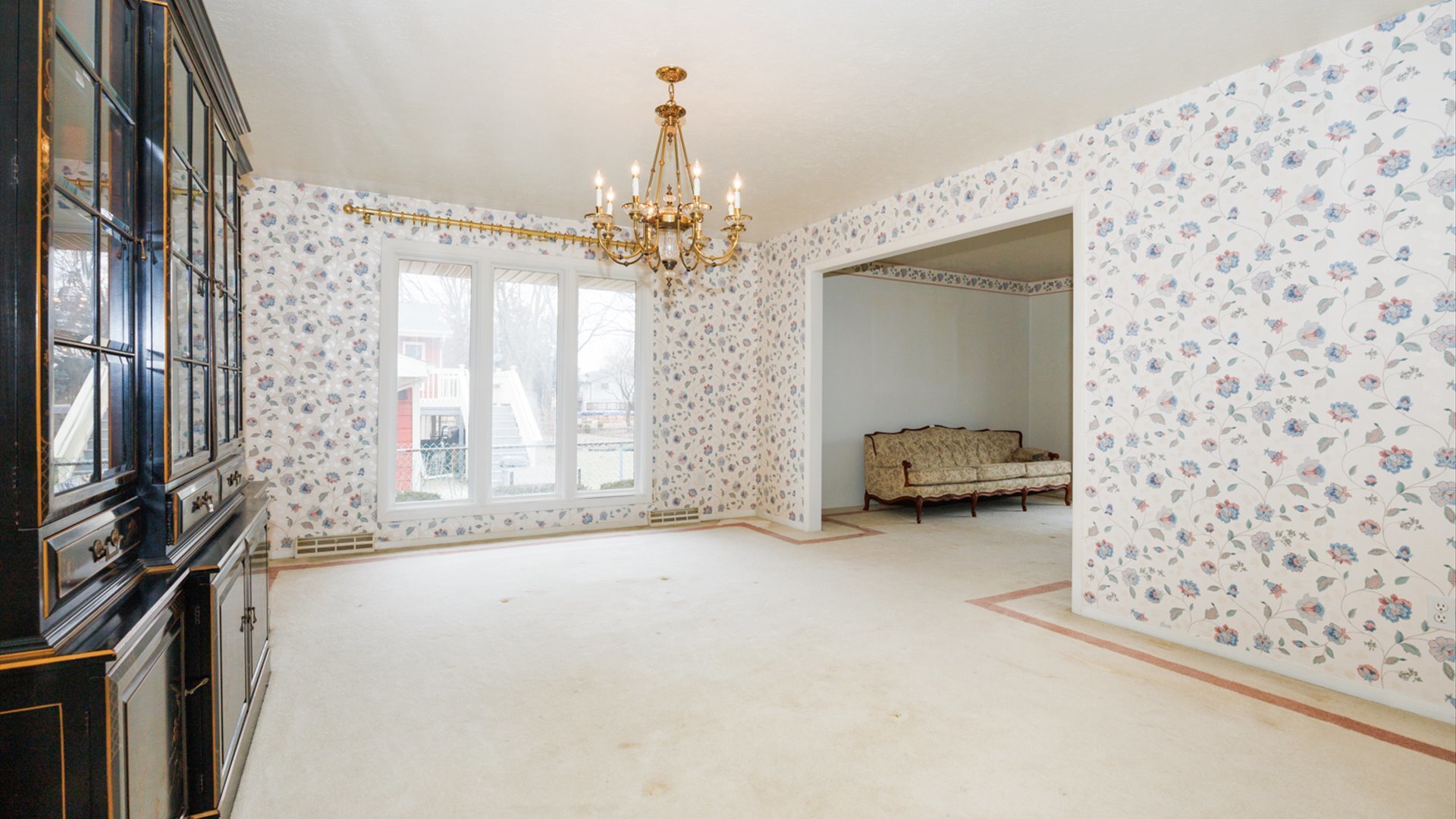 103 Cheltenham Drive Normal, IL 61761 - Photo 18 of 47 a very nice looking room with a large window and chandelier