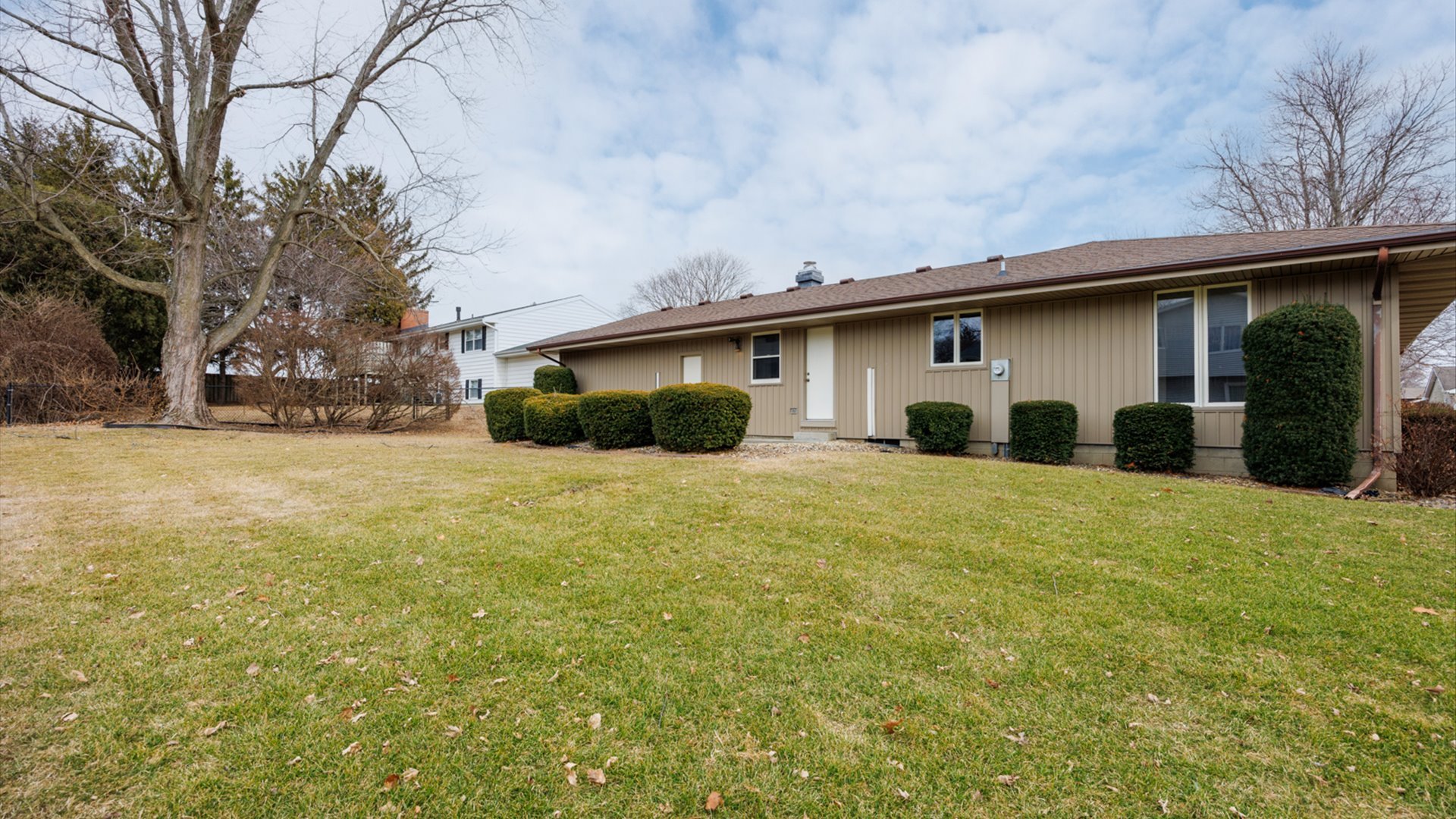 103 Cheltenham Drive Normal, IL 61761 - Photo 45 of 47 a front view of house with yard and trees around
