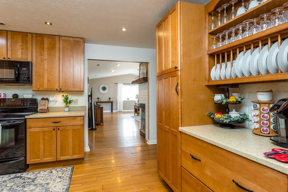 6529 Cross Keys Road Mount Crawford, VA 22841 - Photo 3 of 57 a kitchen with stainless steel appliances granite countertop a lot of cabinets a sink and wooden floor