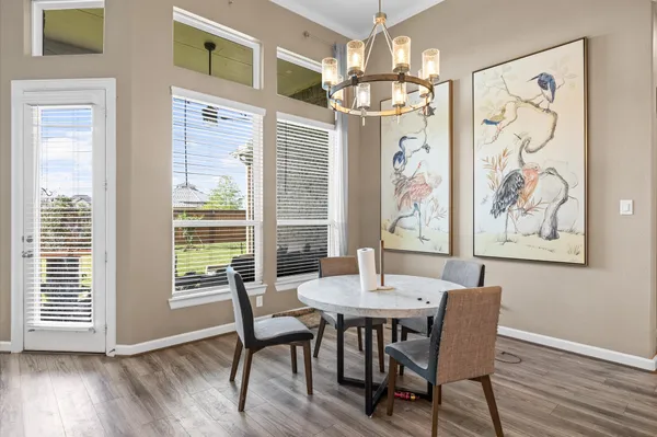 a living room with furniture fireplace and a large window