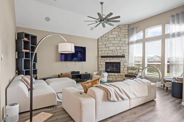 a living room with furniture and a fireplace