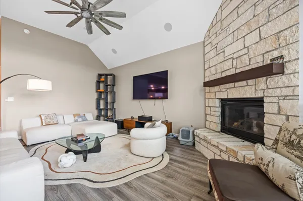 a living room with furniture and a fireplace