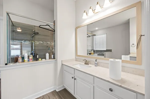 a bathroom with a sink and a window