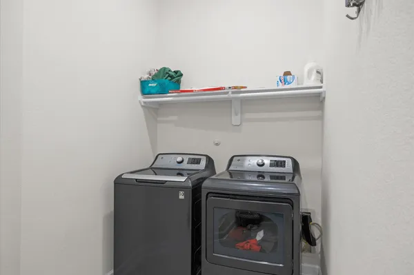 a view of swimming pool with a garden and balcony