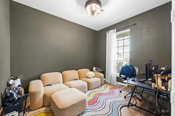 a backyard of a house with table and chairs