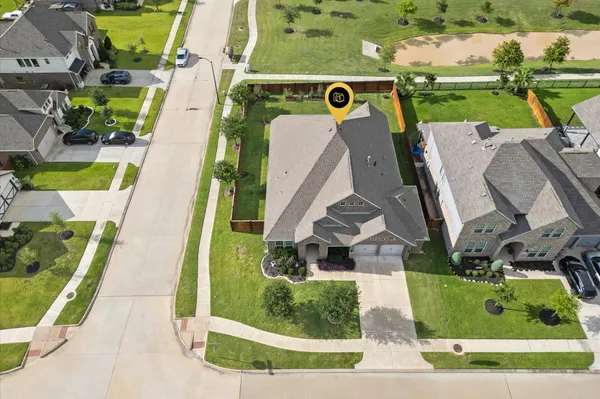 a view of swimming pool with a yard and plants