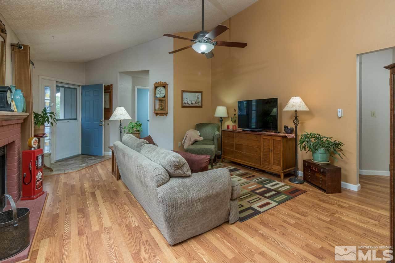 1845 Amarak Way Reno, NV 89523 - Photo 3 of 16 a living room with furniture and a wooden floor