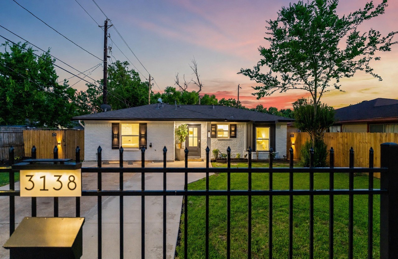 3138 Sunbeam Street Houston, TX 77051 - Photo 2 of 50 Sunset skies, sleek black accents, and glowing curb appeal make this fully refreshed retreat impossible to ignore. Modern charm meets everyday comfort behind a private gated entrance.