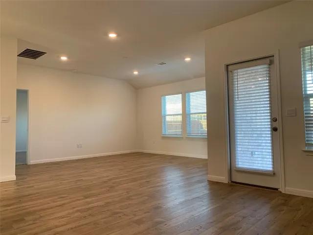 a view of an empty room and closet area