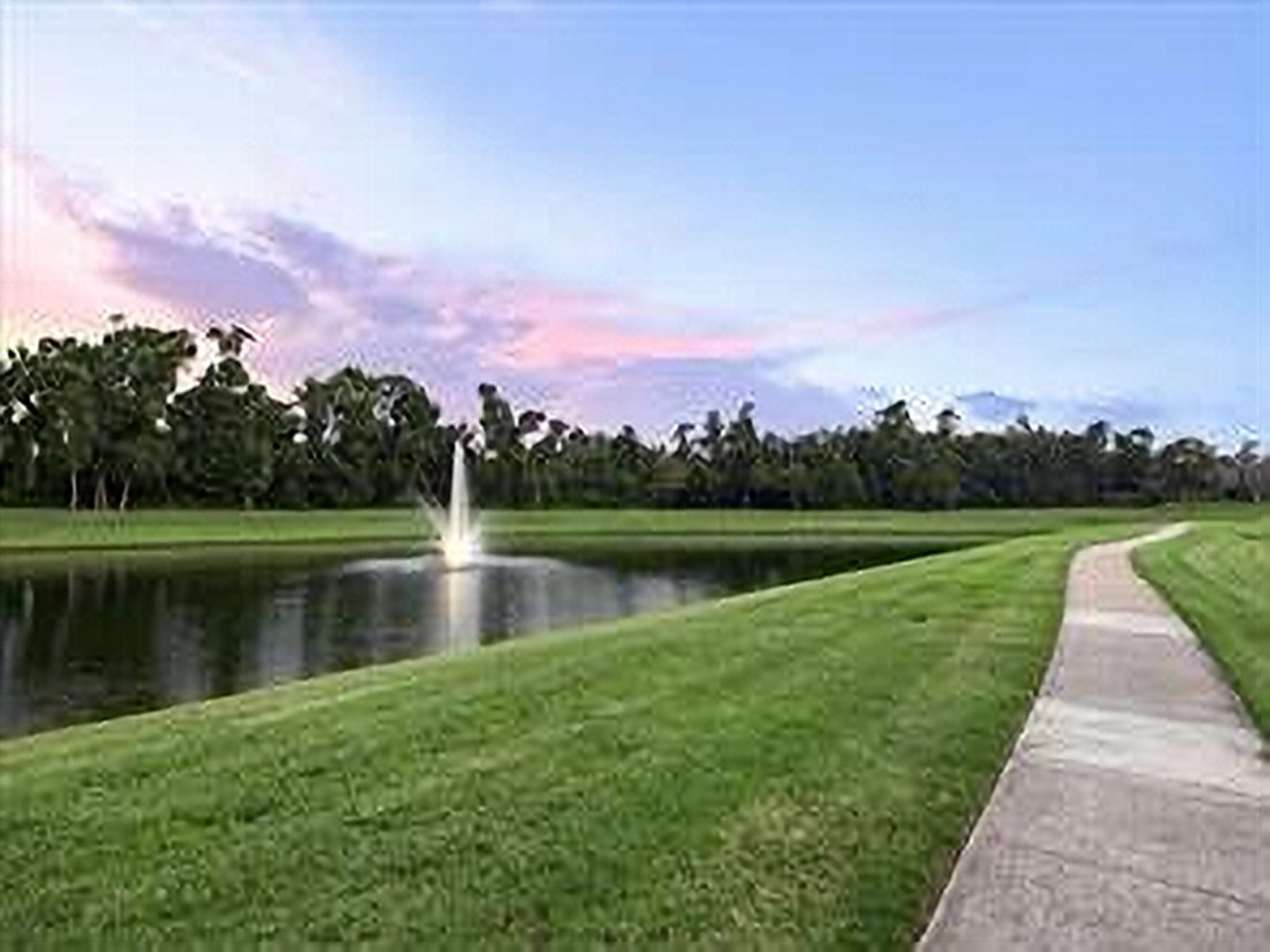 2711 King Point View Lane Spring, TX 77388 - Photo 44 of 48 Enjoy a walk around the beautifully landscaped pond featuring a fountain.