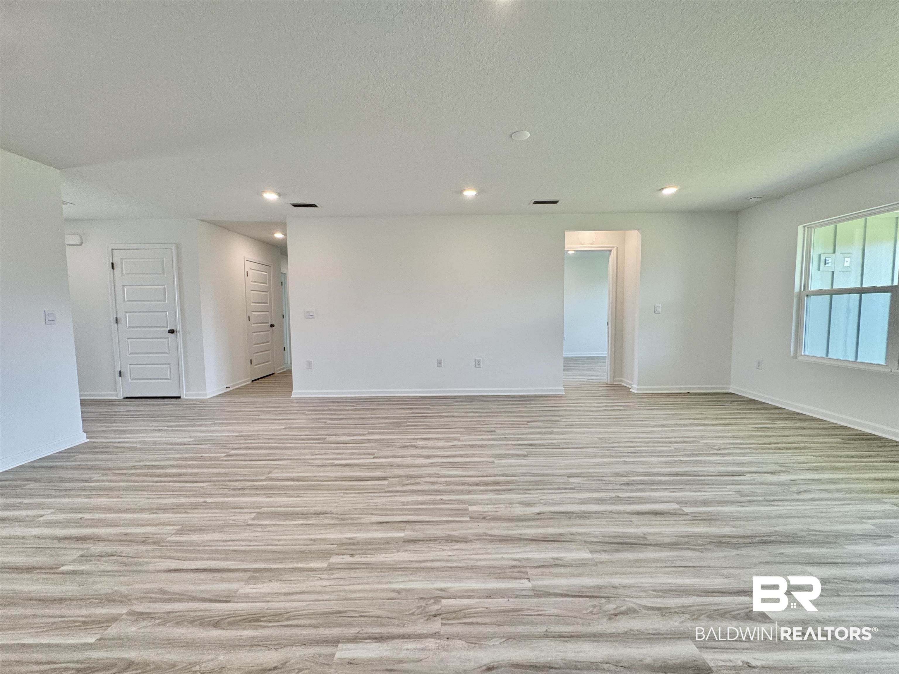 22072 Aleutian Avenue Foley, AL 36535 - Photo 11 of 47 View from kitchen island to living room
