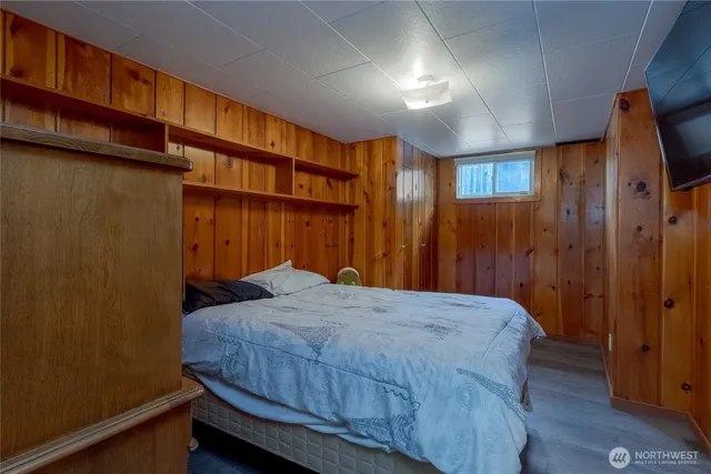 a bedroom with a bed and a closet