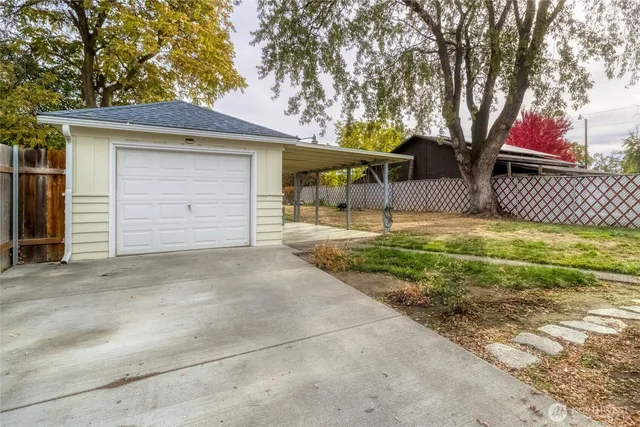 a house that has a tree in front of it