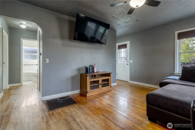 a bedroom with furniture and a ceiling fan