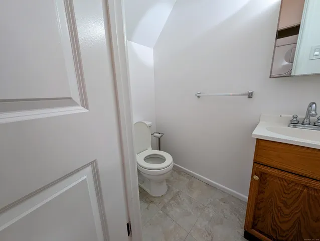 a bathroom with a toilet and a sink