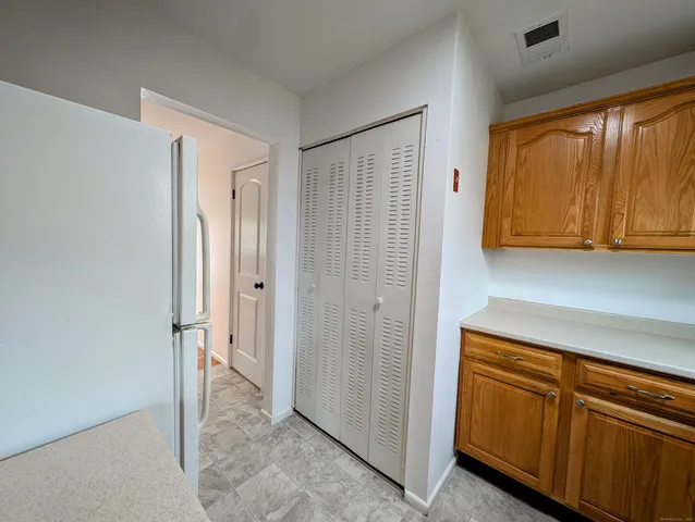 a view of a storage and utility room with window
