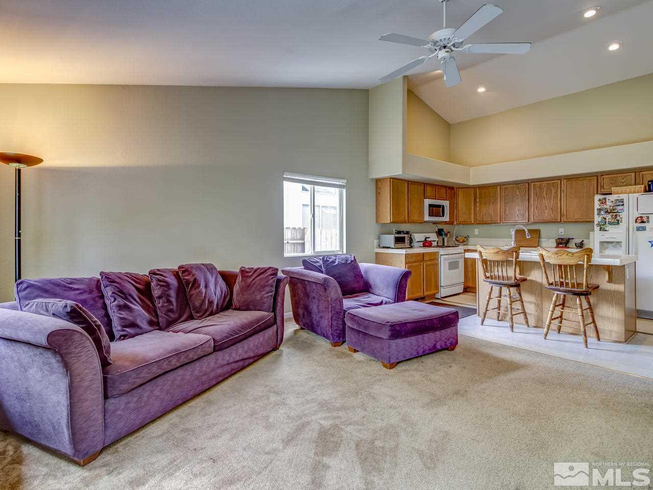 9665 Oakley Lane Reno, NV 89521 - Photo 11 of 23 a living room with furniture and a view of kitchen