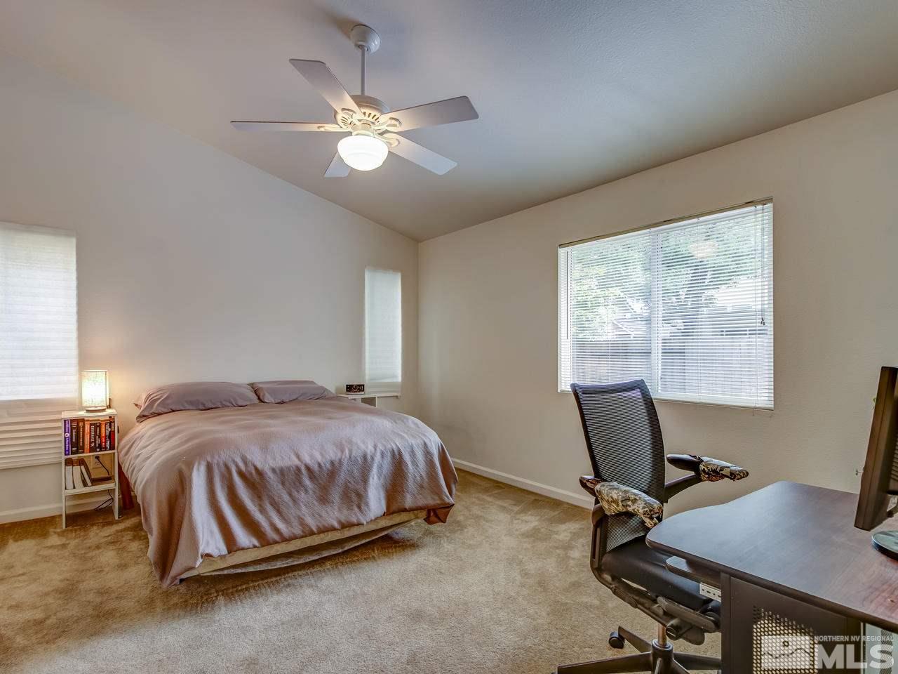 9665 Oakley Lane Reno, NV 89521 - Photo 13 of 23 a bedroom with a bed and a window