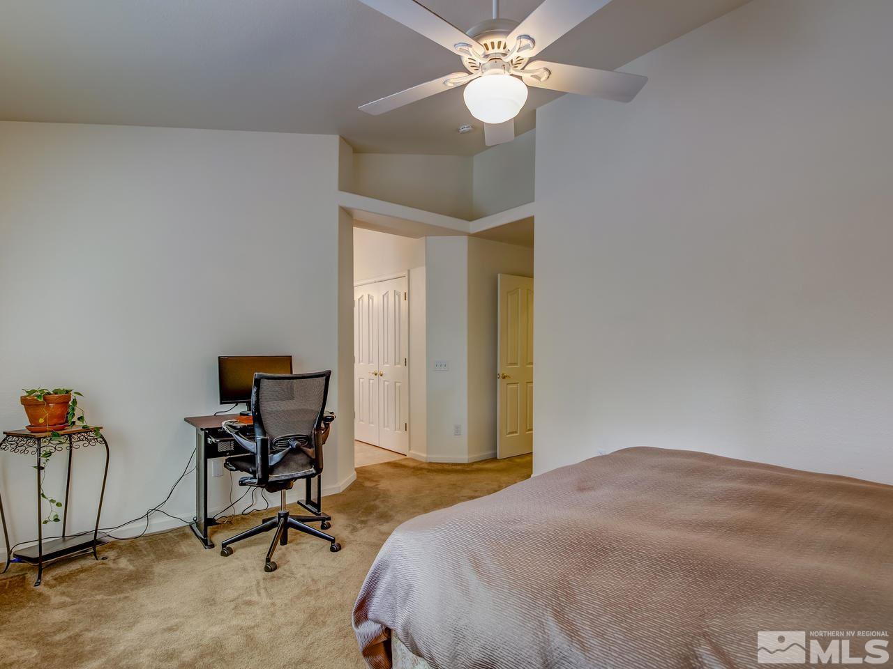 9665 Oakley Lane Reno, NV 89521 - Photo 14 of 23 a bedroom with a bed and a window