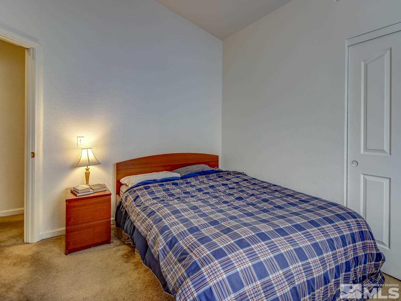 9665 Oakley Lane Reno, NV 89521 - Photo 18 of 23 a bedroom with a bed and closet