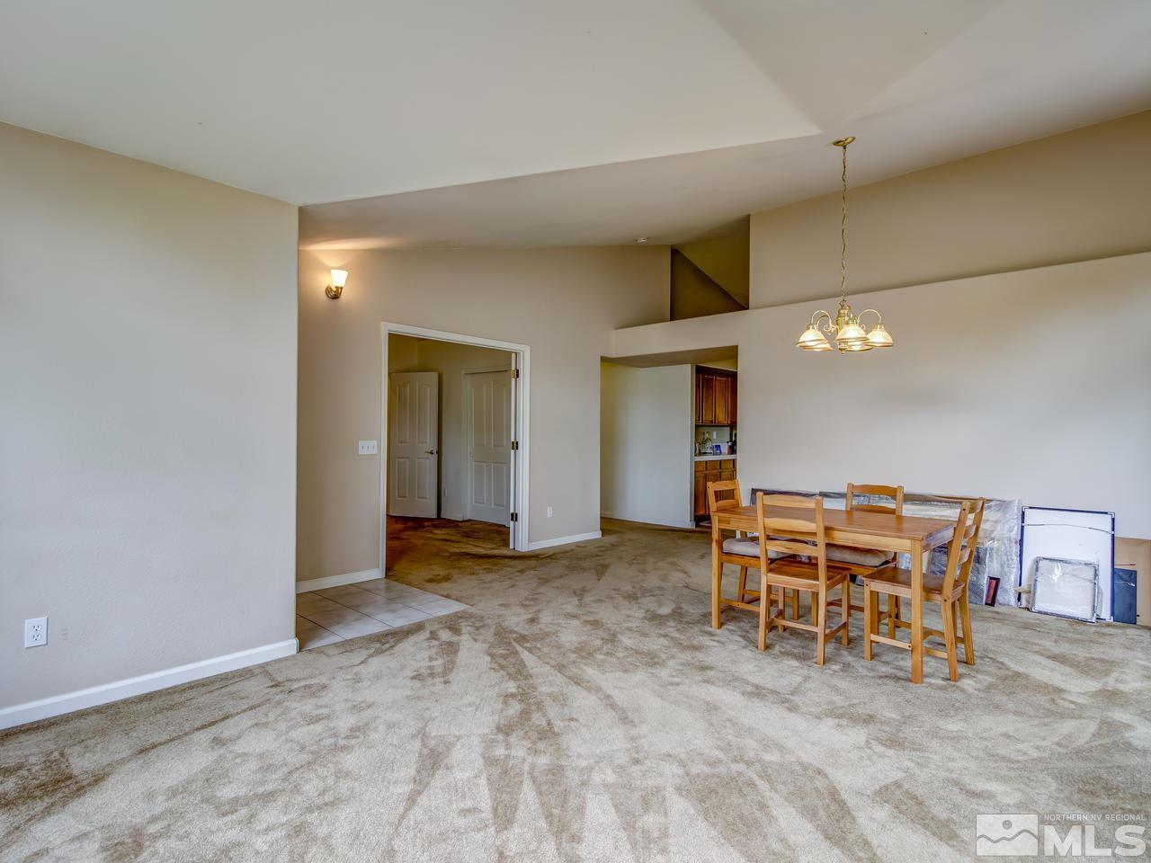 9665 Oakley Lane Reno, NV 89521 - Photo 5 of 23 a view of a livingroom with furniture and chandelier