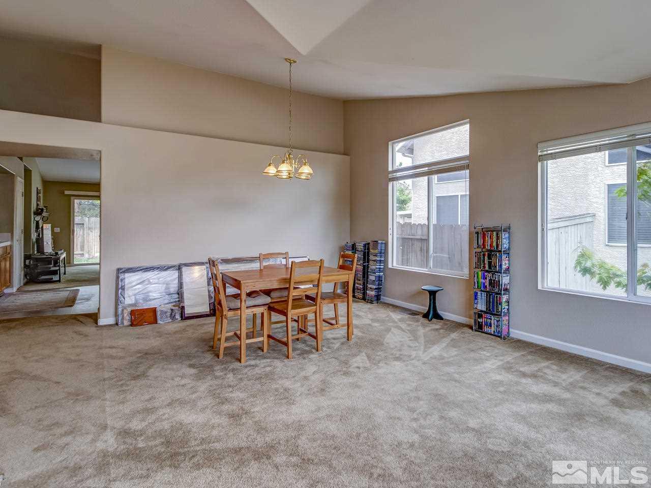 9665 Oakley Lane Reno, NV 89521 - Photo 6 of 23 a view of a livingroom with furniture and windows