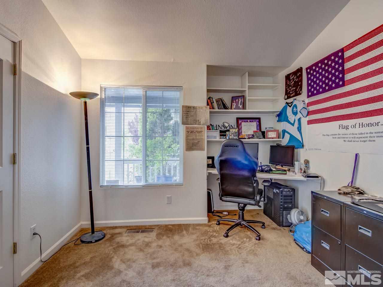 9665 Oakley Lane Reno, NV 89521 - Photo 7 of 23 a view of a workspace with furniture and a window