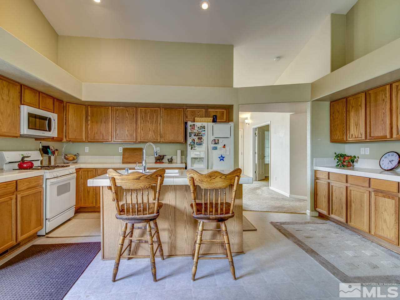 9665 Oakley Lane Reno, NV 89521 - Photo 9 of 23 a view of a dining room kitchen and a sink
