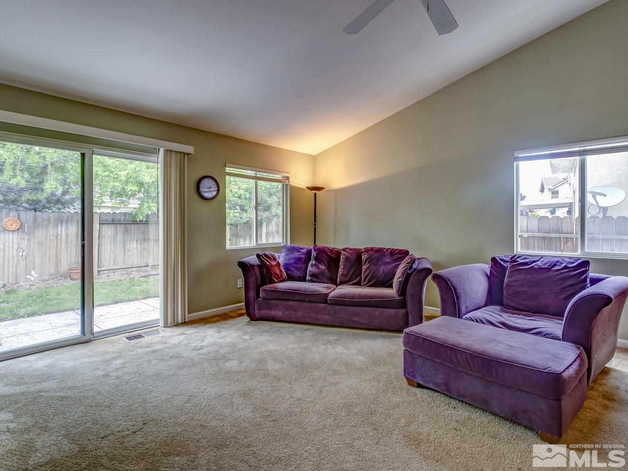 9665 Oakley Lane Reno, NV 89521 - Photo 10 of 23 a living room with furniture and a large window