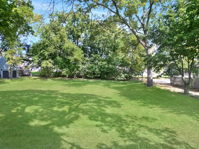 a view of outdoor space with deck and yard