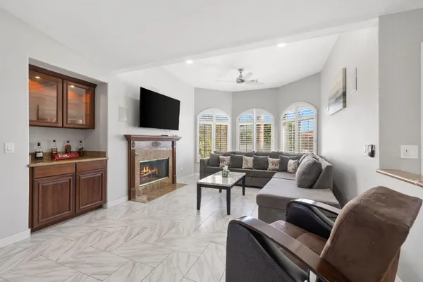 a living room with furniture and a large window