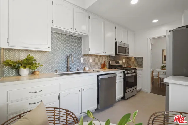 a kitchen with a stove and a microwave