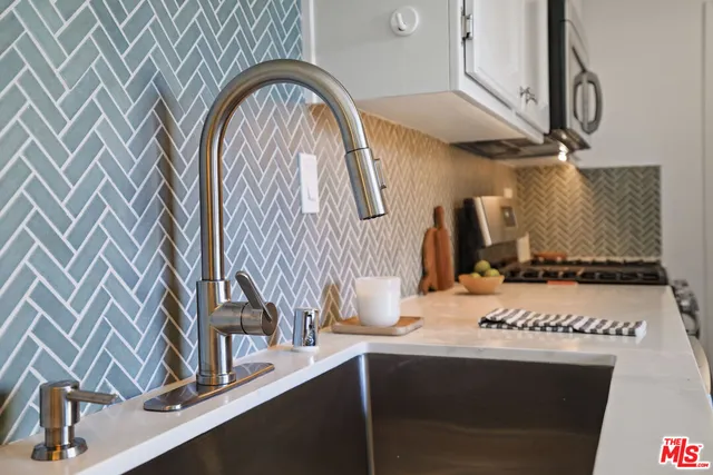 a living room with furniture and a mirror