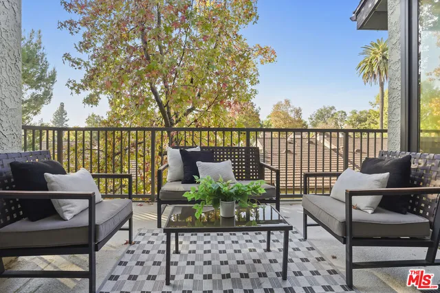 a spacious bedroom with a bed and a couch