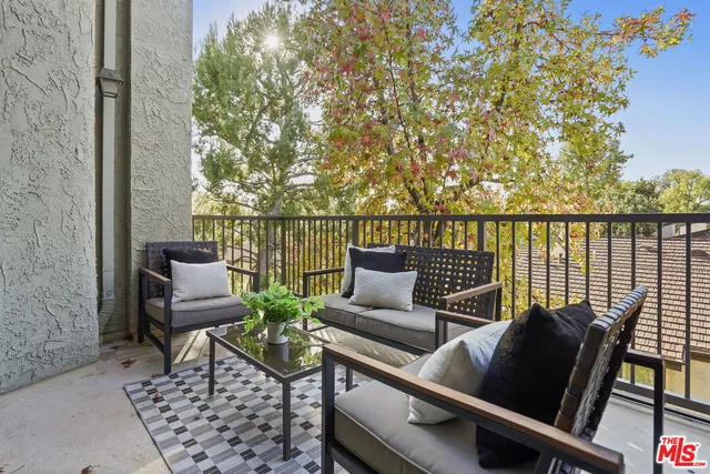 a spacious bedroom with a bed and a couch