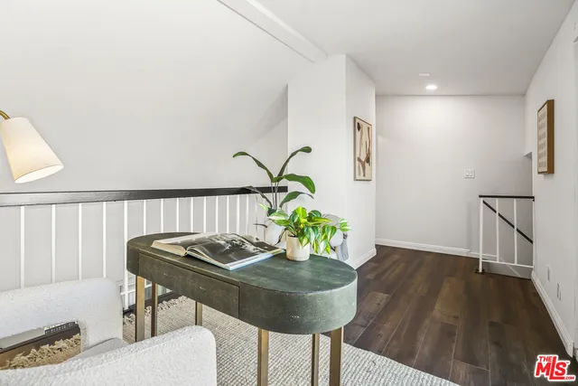 a view of a building with a porch and sitting area