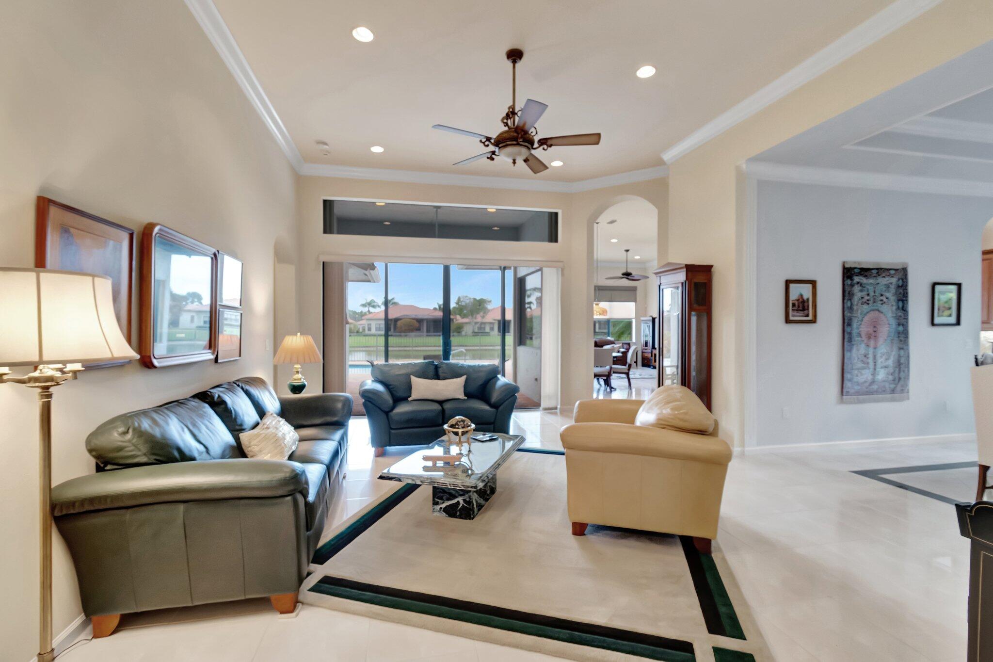 6976 Antinori Lane Boynton Beach, FL 33437 - Photo 15 of 71 a living room with furniture and a large window