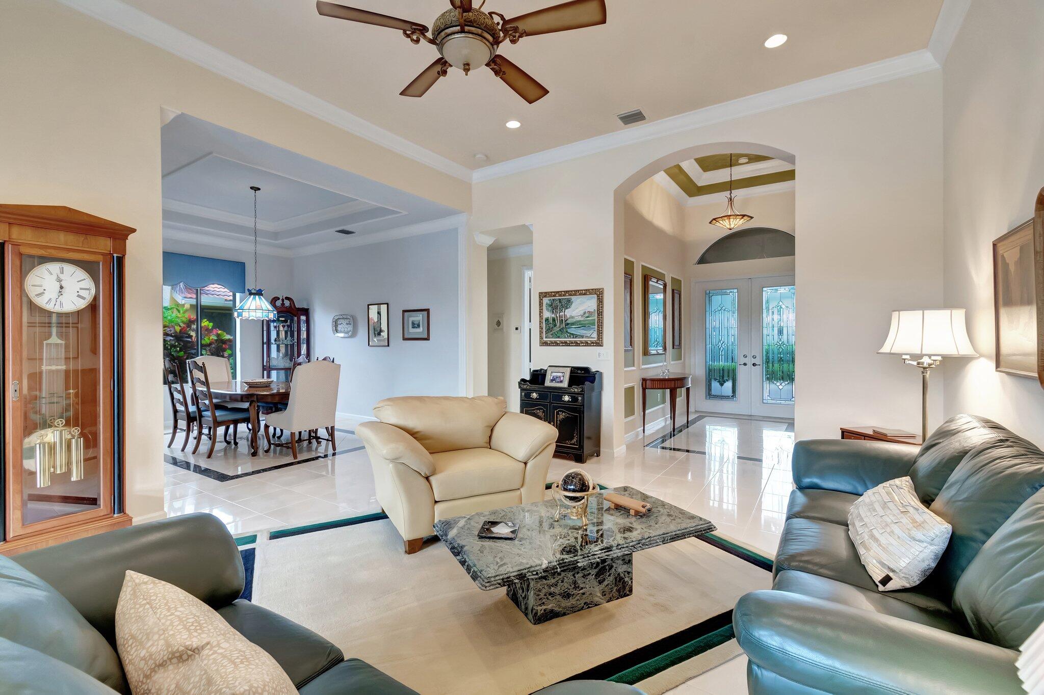 6976 Antinori Lane Boynton Beach, FL 33437 - Photo 18 of 71 a living room with furniture and a large window