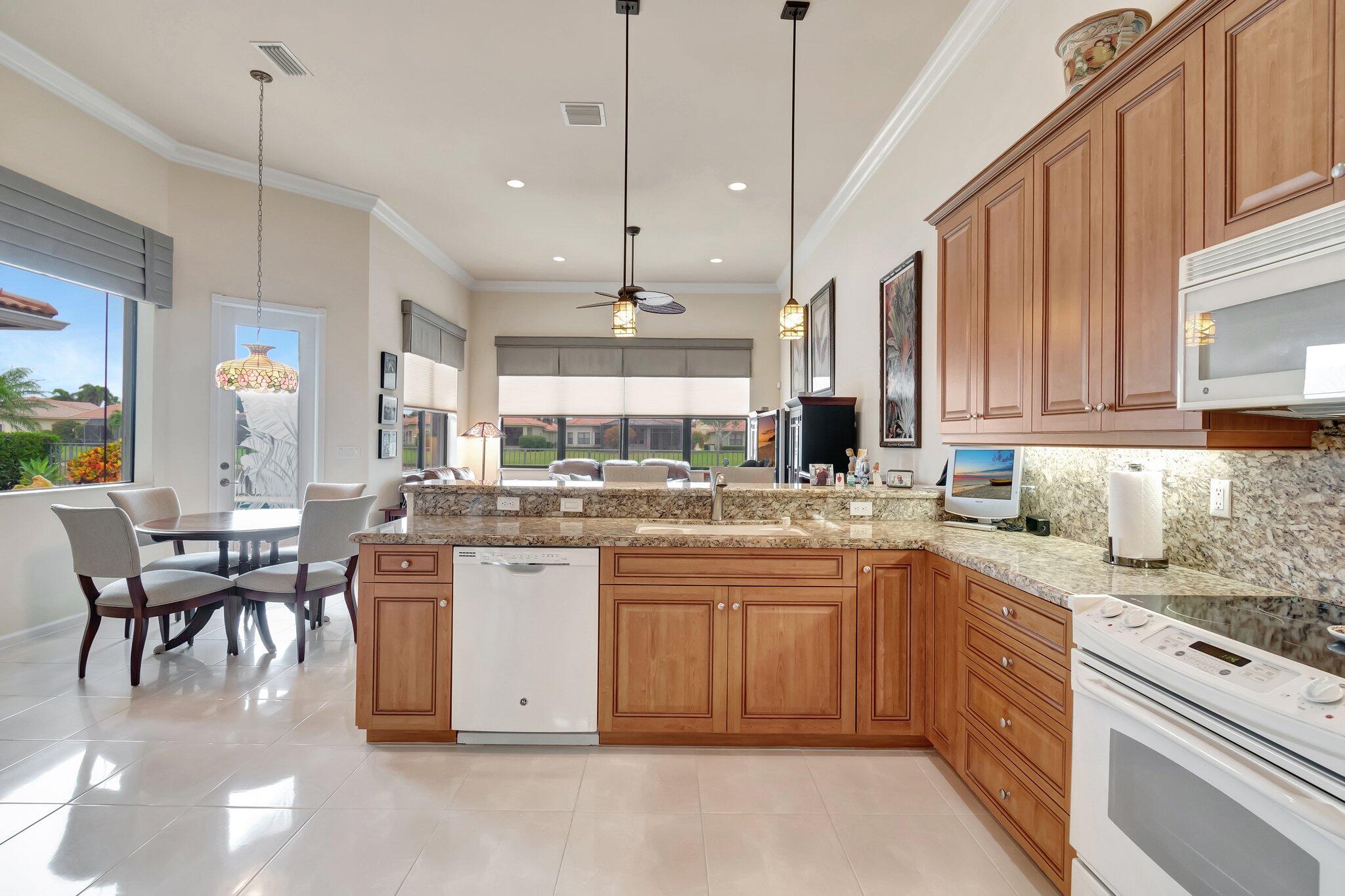 6976 Antinori Lane Boynton Beach, FL 33437 - Photo 23 of 71 a kitchen with lots of counter top space and sink