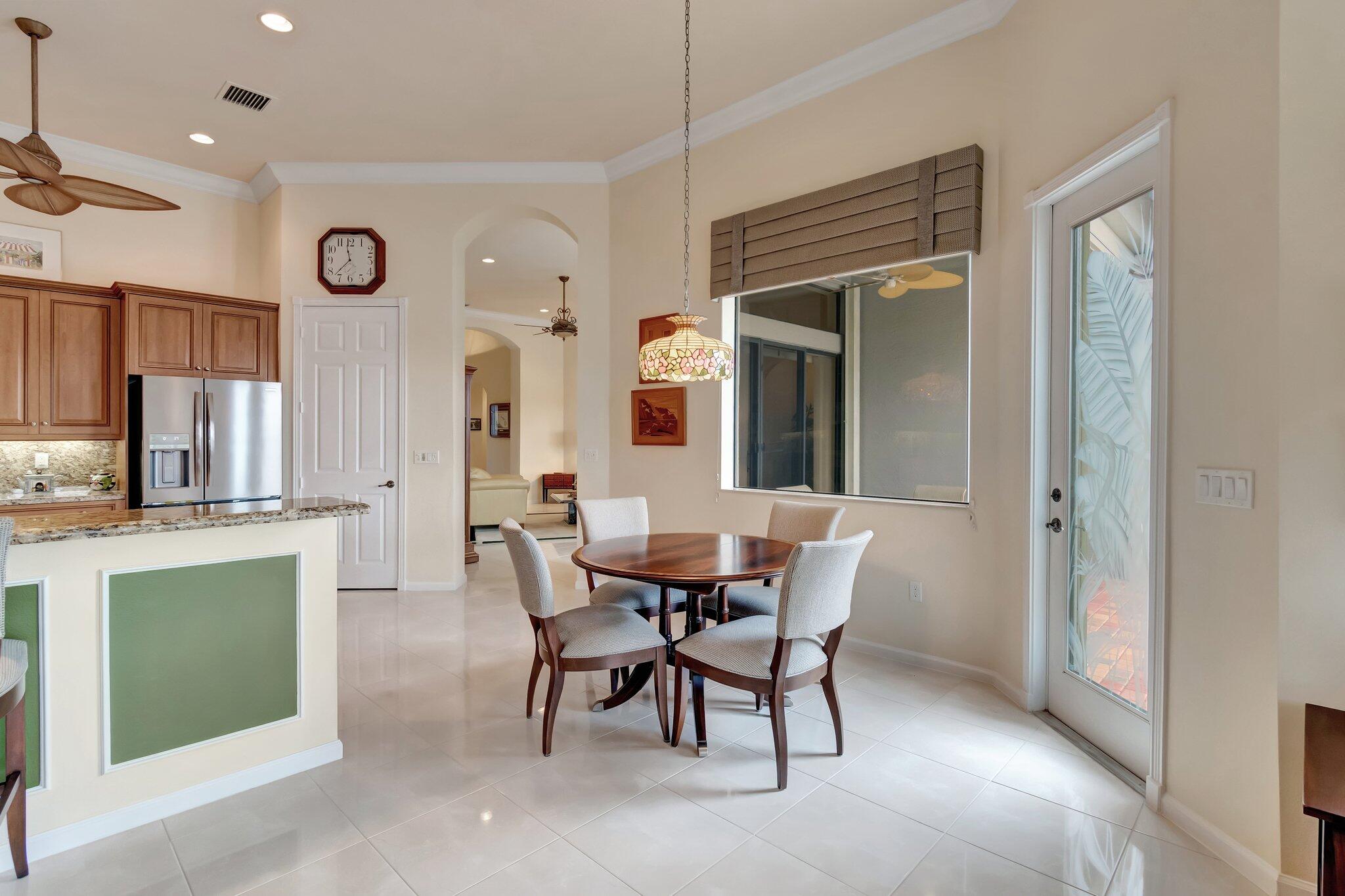 6976 Antinori Lane Boynton Beach, FL 33437 - Photo 25 of 71 a view of a dining room with furniture