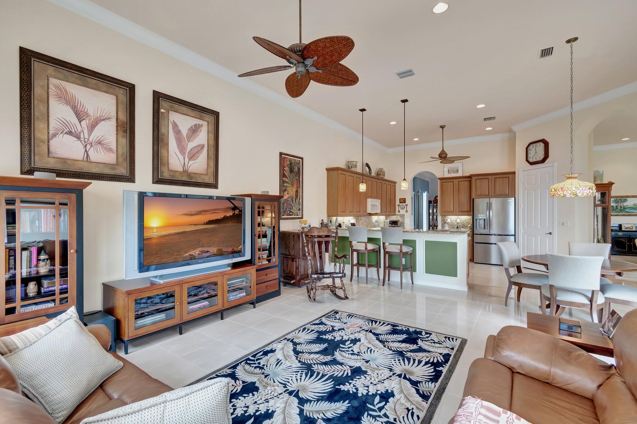 6976 Antinori Lane Boynton Beach, FL 33437 - Photo 28 of 71 a living room with furniture and a flat screen tv